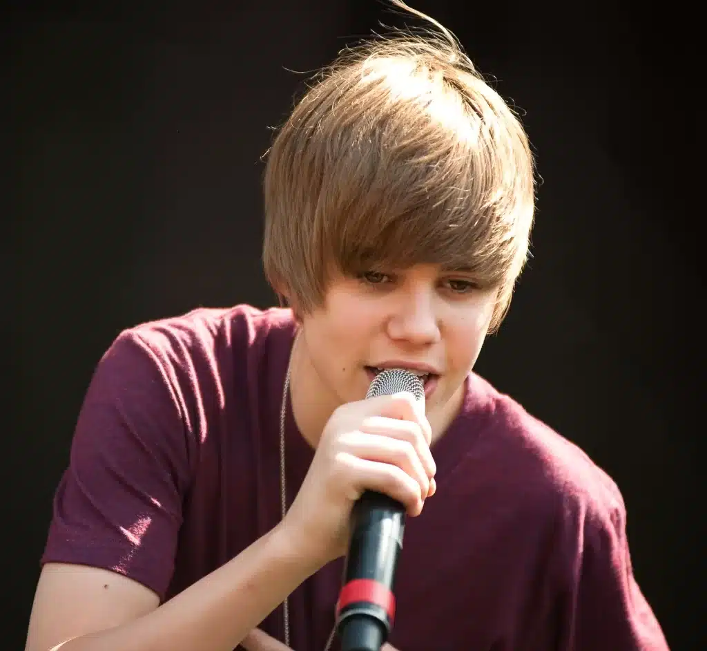 What was Justin Bieber's first hit song?