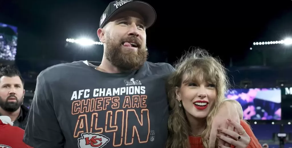 Taylor Swift and Travis Kelce celebrating the Kansas City Chiefs' AFC Championship win on the field